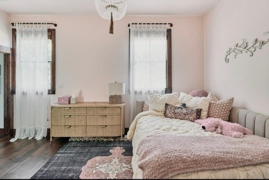 Design consulting — soft pink girls bedroom with rattan dresser